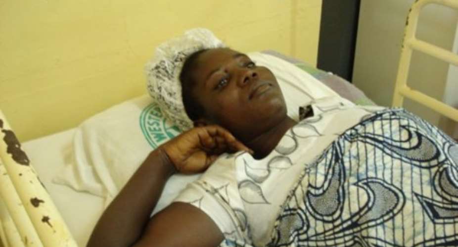 Millicent Asthur lying on her hospital bed at Takoradi hospital after the rescue